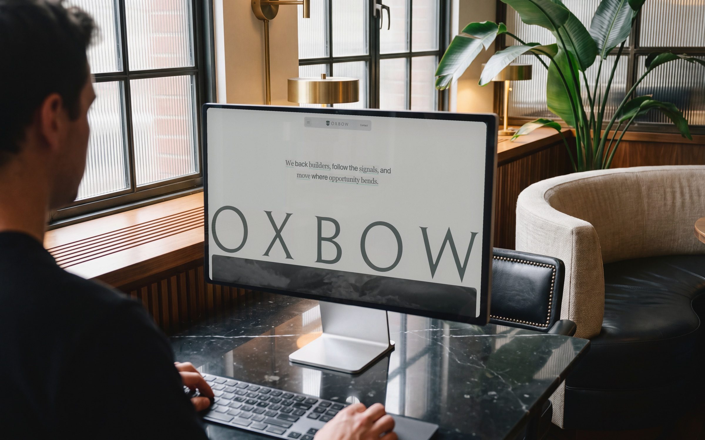 The Oxbow site on a monitor in a club office