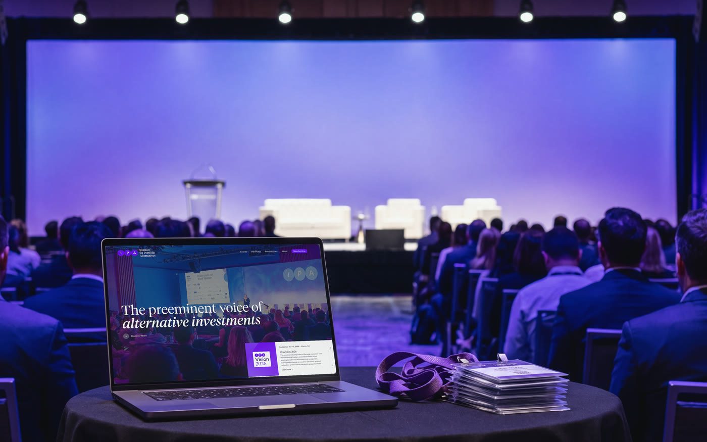 Institute for Portfolio Alternatives, the site on a laptop at a conference